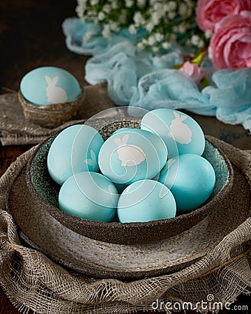 Unusual Easter on dark old background. Concept of new life, rebirth. Rustic style Stock Photo