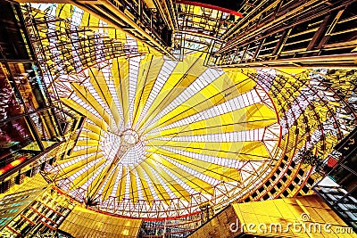 an unusual light roof over the Sony center in Berlin and its reflection in the glass windows of an office building Editorial Stock Photo