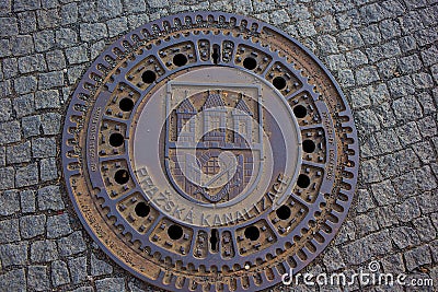 Unusual manhole cover in Prague. Editorial Stock Photo