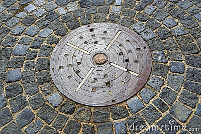 Unusual pavement with creative concentric pattern from metal dec Stock Photo