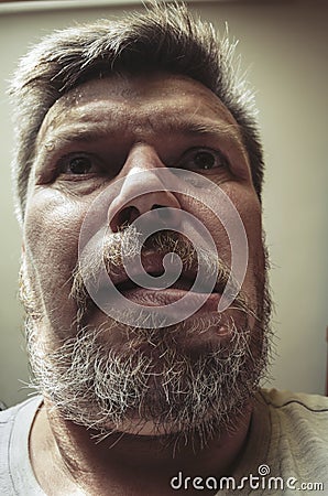 Unusual portrait of an adult bearded man Stock Photo