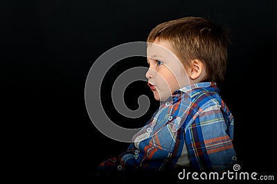 An unusual portrait of a beautiful blond boy Stock Photo