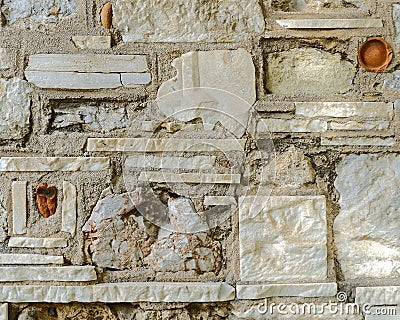Unusual random shapes stone wall closeup Stock Photo