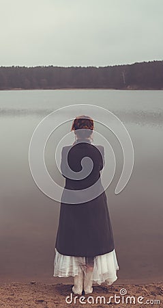 Unusual woman in long skirt as concept outdoors Stock Photo