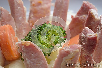 Unusually presented meal of gammon slices, mash, carrots and broccoli Stock Photo