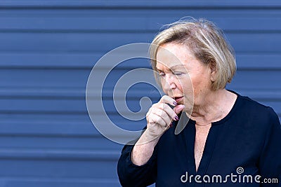 Unwell elderly lady having a coughing fit Stock Photo