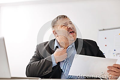 Unwell tired worker feeling stressed out Stock Photo