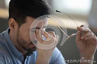 Unwell young man struggle with blurry vision Stock Photo