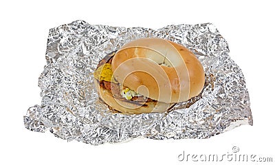 Unwrapped breakfast bagel sandwich on tinfoil Stock Photo