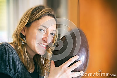 Unwrapped easter egg woman happy smile portrait Stock Photo