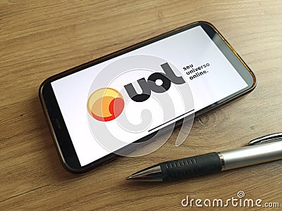 UOL logo displayed on mobile phone Editorial Stock Photo