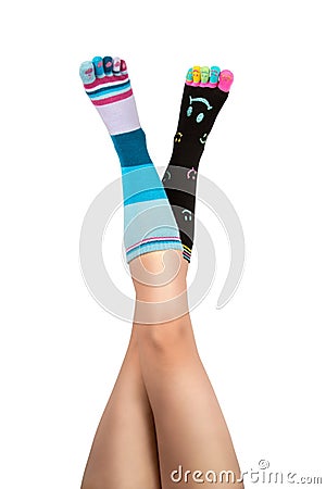 Up In The Air Feet in differnet socks with toes Stock Photo