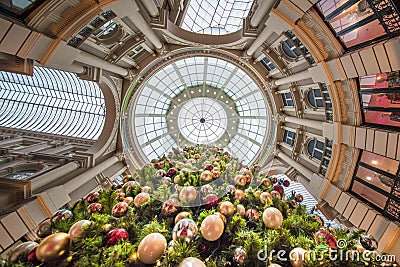 Up view of a Christmas tree with its shiny decorative balls in a Stock Photo