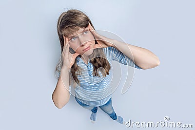 Up view of standing woman with emotional face grimace Stock Photo