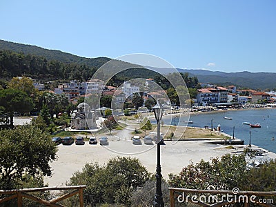Up view to sea, sea dock and promenade next to the town sea in Olympiada, Greece Editorial Stock Photo