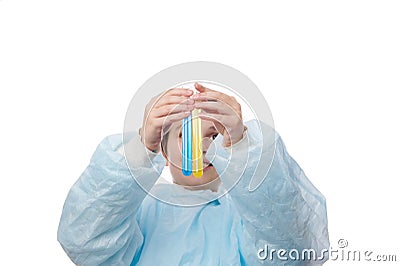 Upbeat teenage boy in blue lab coat, lifts up test tubes with chemical liquid and shows the ongoing reaction inside it Stock Photo