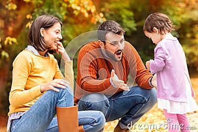 Father shouts to his little daughter trying to explain to her th Stock Photo