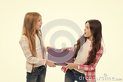 Upbringing and greediness problem. Greedy friends. Greedy children concept. Share book with classmate. This is my Stock Photo