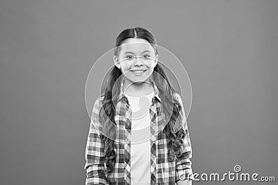 Upbringing versatile personality. Wellbeing and health. Childhood concept. Girl child stand orange background. Happy Stock Photo