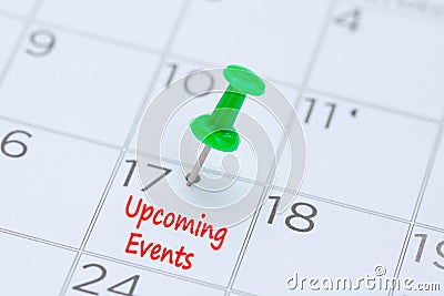 Upcoming Events written on a calendar with a green push pin to r Stock Photo