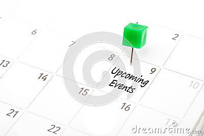 Upcoming Events written on a calendar with a green push pin to r Stock Photo