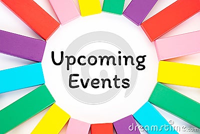 Upcoming Events written on a white paper with a colorful wooden blocks toys to remind you and important appointment Stock Photo