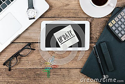 Update text on tablet computer, Office desk with computer techno Stock Photo
