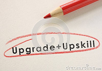 Upgrade and Upskill text circled in red pencil Stock Photo