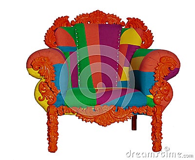 Upholstered armchair with wooden legs. Bright upholstery. A combination of retro, vitage and modernity. Stylish Stock Photo
