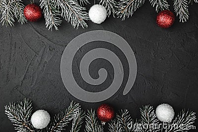 Upper, above, top view of pine, evergreen, and Christmas red and white toys on stone background. Stock Photo