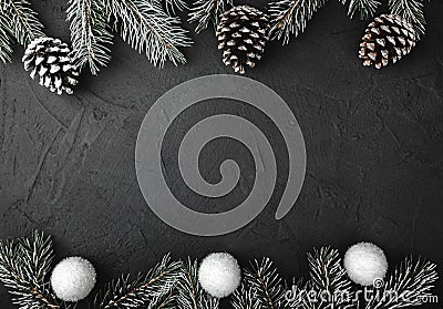 Upper, above, top view of pine, evergreen, and Christmas red and white toys on stone background. Stock Photo