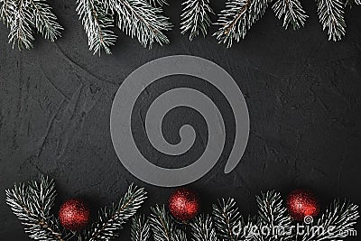 Upper, above, top view, stone background of pine, evergreen, and Christmas red toys. Stock Photo