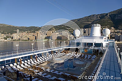 Upper deck swimming pool of Insignia Oceania Cruise ship as it cruises Mediterranean Ocean, Europe Editorial Stock Photo