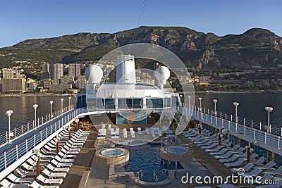 Upper deck swimming pool of Insignia Oceania Cruise ship as it cruises Mediterranean Ocean, Europe Editorial Stock Photo