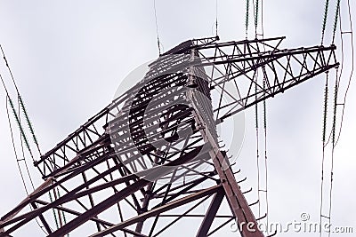 Upper fragment of steel lattice transmission tower overhead power line Stock Photo