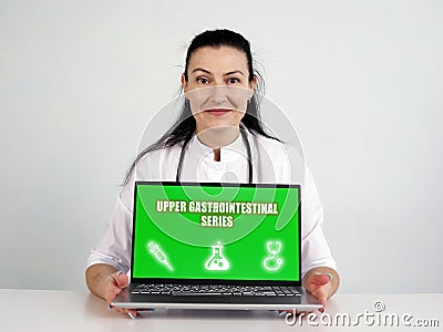 UPPER GASTROINTESTINAL SERIES text in search line. Medic looking for something at computer Stock Photo