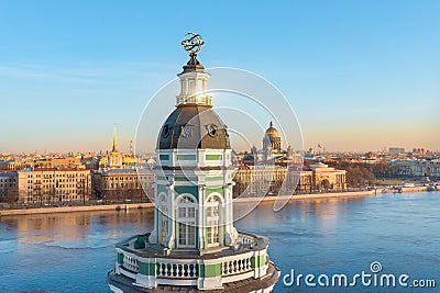 The upper part of the Kunstkamera building with an armillary sphere. View of the Neva River, the Admiralty and St. Isaac`s Stock Photo