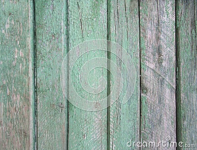 Upright striped wooden wall, fence, background with old threadbare green paint Stock Photo