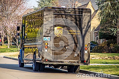UPS panel truck dusty and dirty at back parked at curb in residential area in springtime Editorial Stock Photo