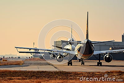 UPS A300 and a Western Global Airlines MD11F taxi out to the runway Editorial Stock Photo