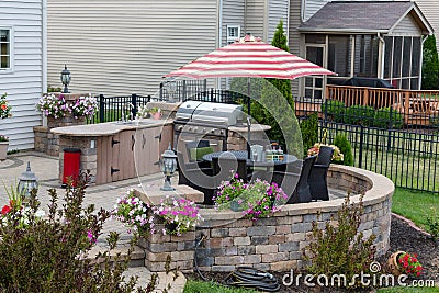 Upscale backyard round brick patio Stock Photo