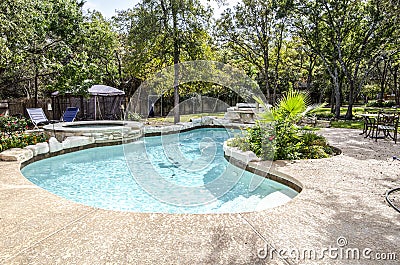 Upscale Swimming Pool in Backyard Stock Photo