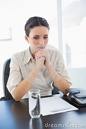 Upsed stylish brunette businesswoman joining her hands Stock Photo