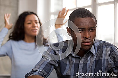 Upset african husband feels disappointed in love ignoring angry Stock Photo