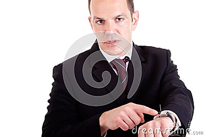 Upset businessman pointing to the watch Stock Photo