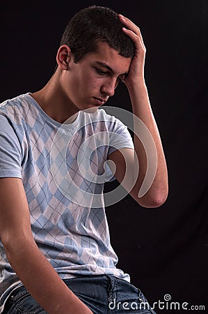 Upset caucasian teenager with hand on head Stock Photo