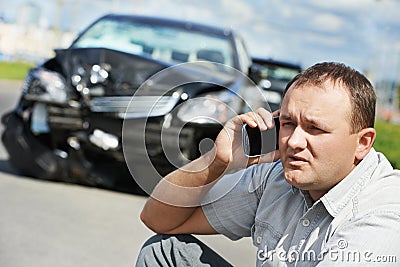 Upset driver man after car crash Stock Photo