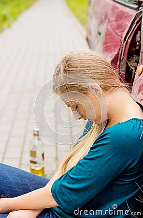 Upset driver woman in front of automobile crash car. Stock Photo