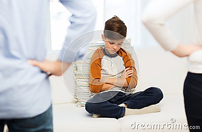 Upset or feeling guilty boy and parents at home Stock Photo