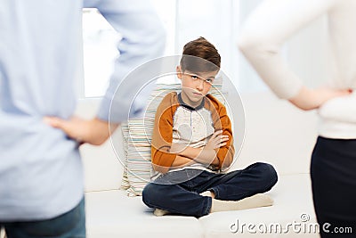 Upset or feeling guilty boy and parents at home Stock Photo